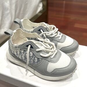 Authentic Dior kids  sneakers run exact would size up. Originally $710.